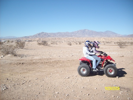 Sierra on back of first Quad ride.