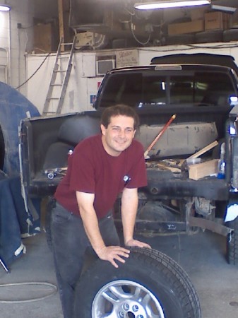 My husband Guy at his bodyshop.