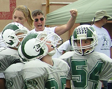 KJ cheering for son's football team