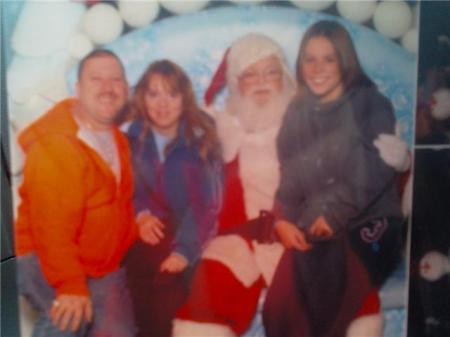 My husband Jimmy,me,Santa,and my niece Cindi