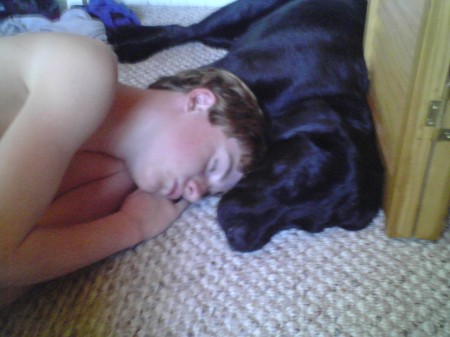 Son napping with our dog