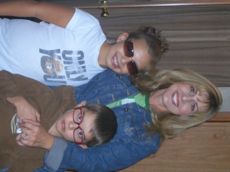 Teri and kids in our trailer camping