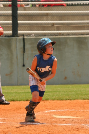 Daughter Kelsey knockin' one to the fence!