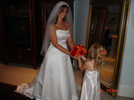 My flower girl handing me my bouquet