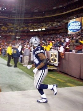Marion Barber taking the field . . .