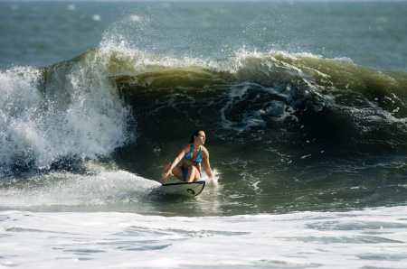 Allison surfing in OBX