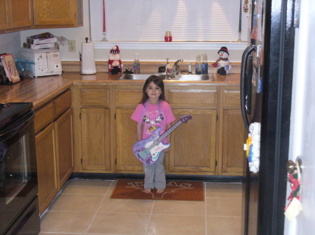 Ashley with her Hannah Montana guitar