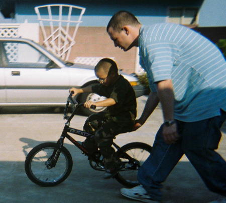 UNCLE JEREMY HELPED ME TO RIDE MY BIKE.