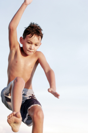 my very athletic 7 year old son long jumping in track