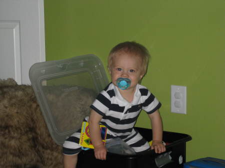Spencer in his toy bin