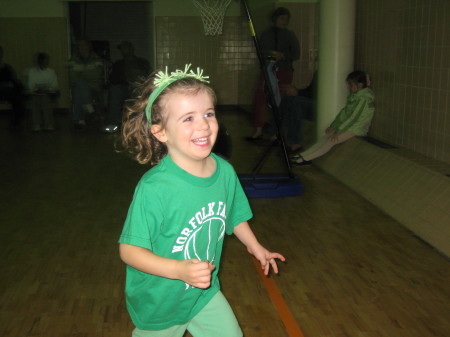 Caitlin playing basketball at the YMCA