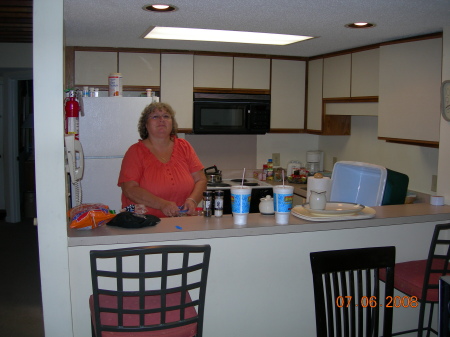 My wife, Linda, in the kitchen of our condo.