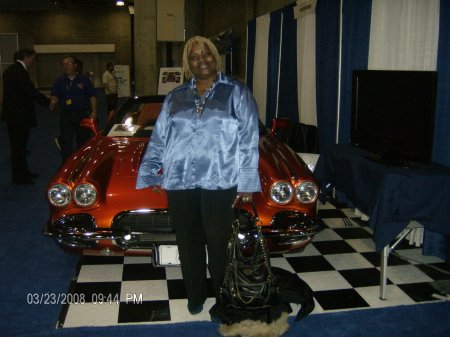 Posing in front of a made over mustang sally