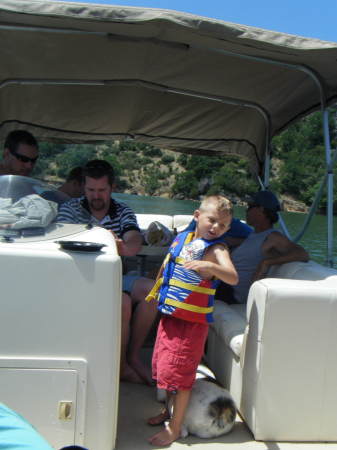 My son and our dog on our boat Summer 08
