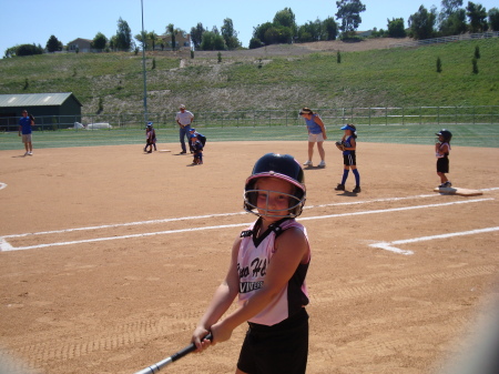 Tori playing softball