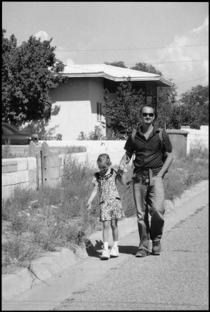 father and daughter walking to end of line