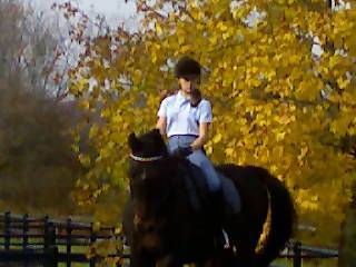 Julia riding her horse Bentley