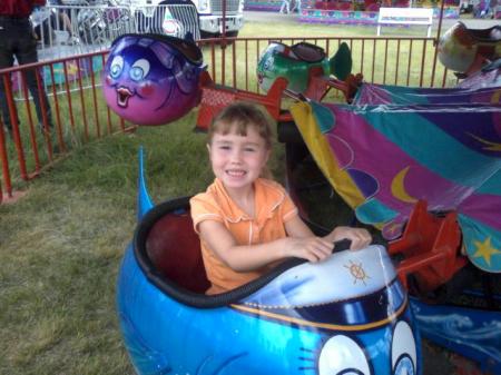 My smiling daughter Mackenzie at the fair.