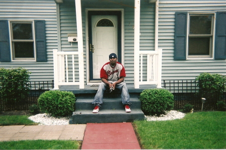 Me Sitting in Front of Our Old House