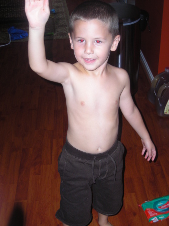 Our half naked son waving for the camera!