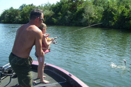 Peyton catching her first fish!
