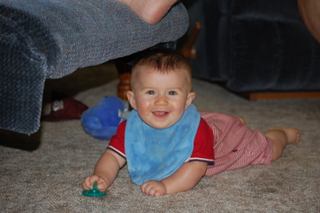 Evan under his Gigi's chair