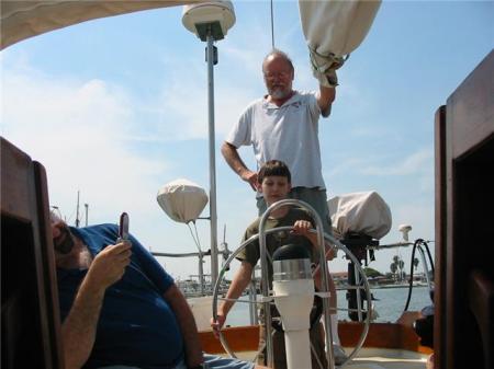 Alex driving the sailboat
