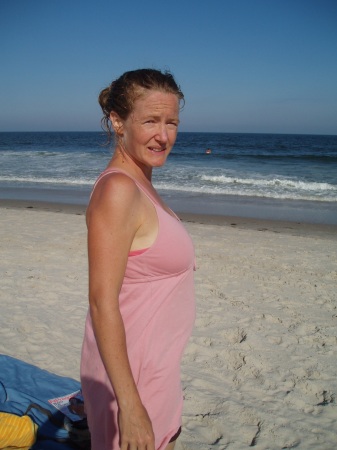 Baby in the belly at the beach