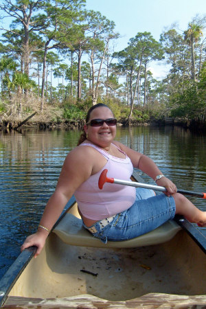 My Wife posing on the canoe