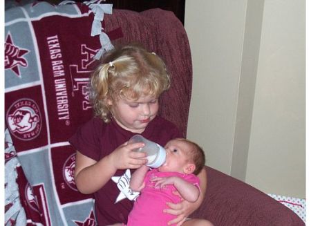 Big Sister Bailey feeding Peyton 8-2008