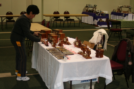 Adela sets up the "Williams' Woods" table