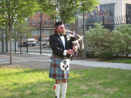 Curt Anderson playing pipes for a 9/11 Memorial