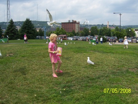 Cady Feeding The Pigeons