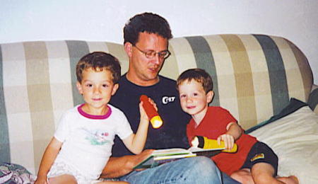 My boys with their dad-story time, 2001
