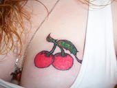 cherries on dannielles boob, very nice, tattoo that is