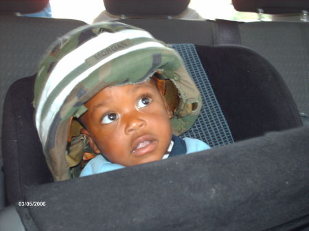 CHRISTIAN WEARING HIS MOMS COMBAT HELMET.