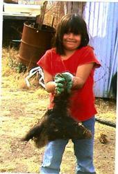 Jennavie holding a pig head