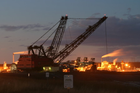 Syncrude's old equipment and upgrader in the background