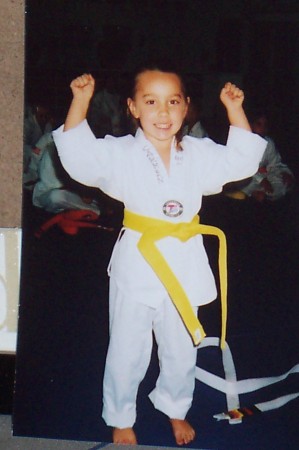 carmen getting her yellow belt at 4 yrs. old