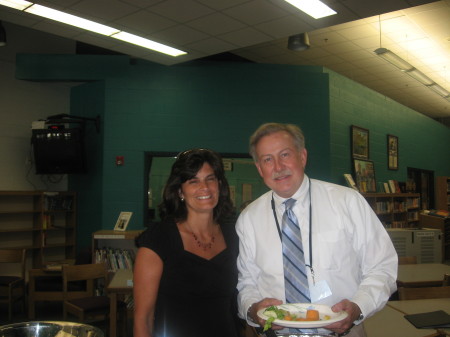 Betsy is PTSA President.  Here she is with the Superintendent.