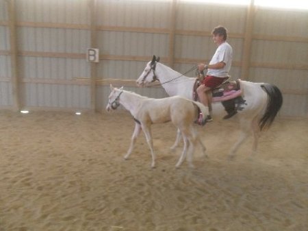 Darrell riding Josey, Spud along side