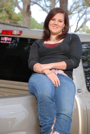 Macy sittin on her truck