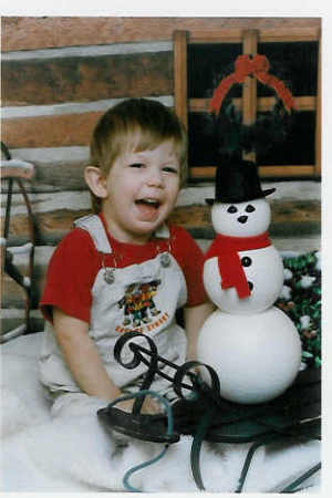 Brandon with a snowman.