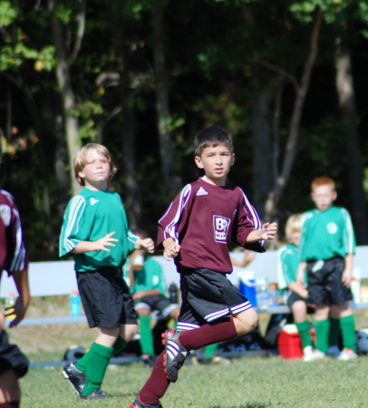 Son Joshua playing soccer.