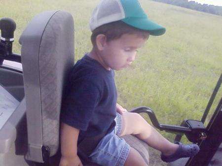 Kris riding tractor