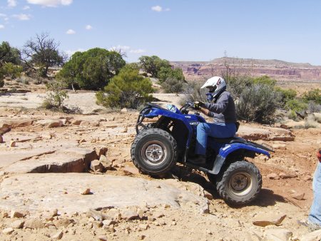 Bobbie riding the rocks in Moab