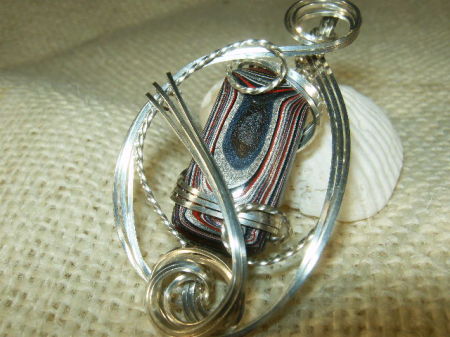 Wire sculpted fordite