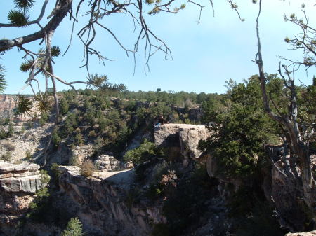 Look carefully...who's the crazy chick sitting on the canyon cliff?