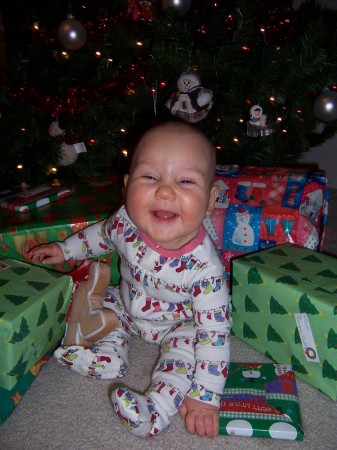 Emma smiles for her Christmas picture 7 1/2 months