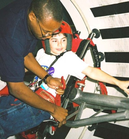 Son in anti-gravity harness